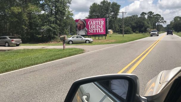 New father surprised by co-workers with billboard