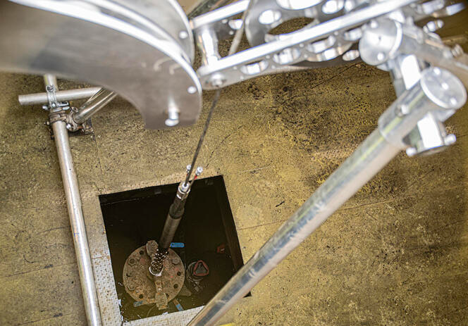 A close up view from above of the SysMoG™ probe in position before being lowered into the borehole. The monitoring device was miniaturised to fit into a shaft 6 cm in diameter.